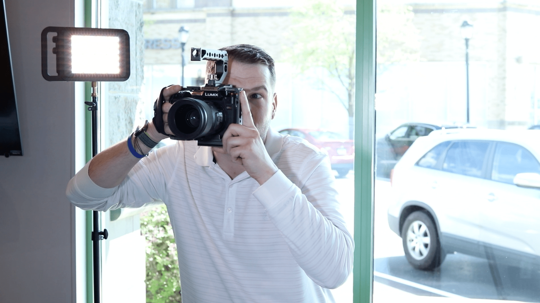 Eric holding camera up to his eye