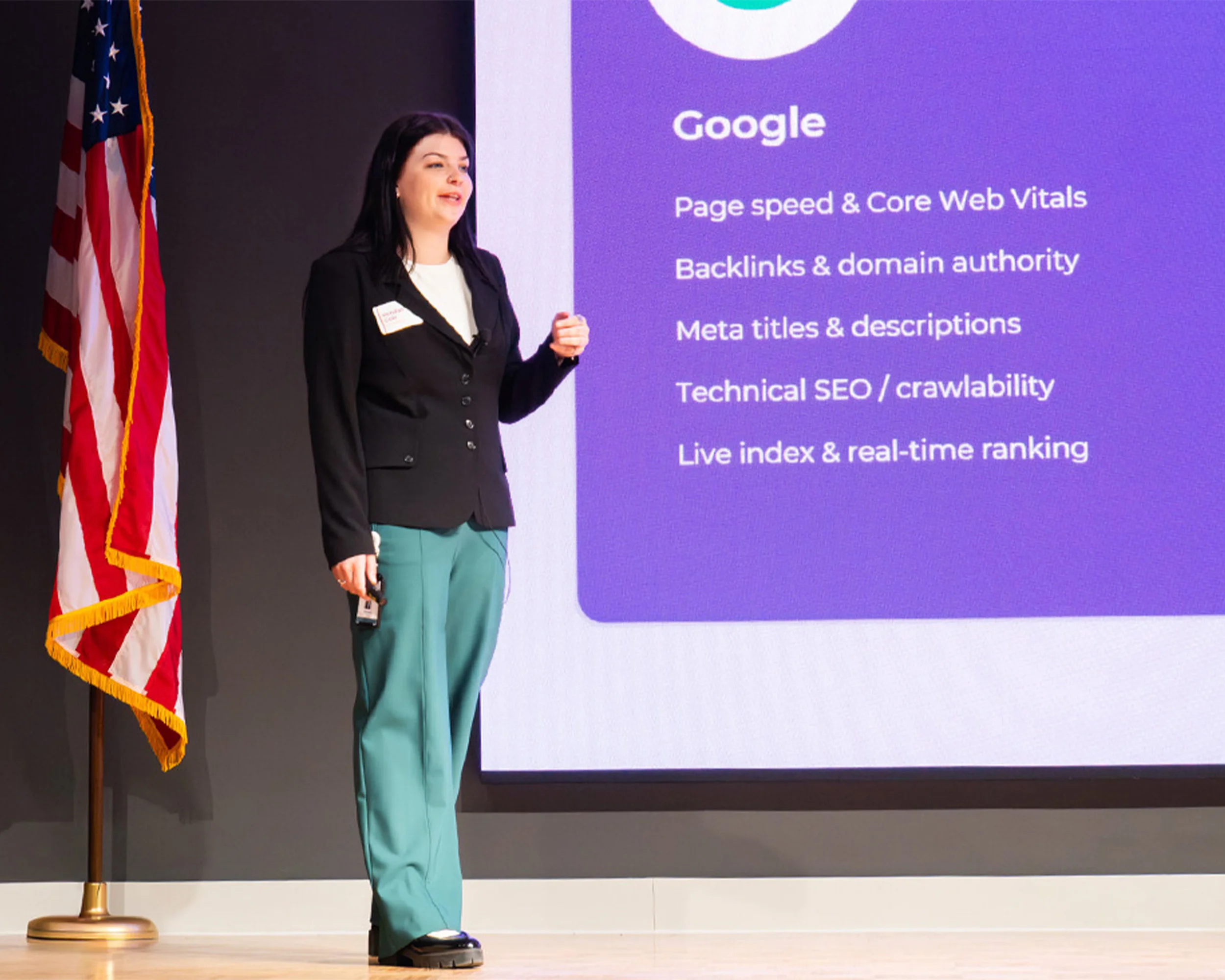 Kendall presenting a presentation on a stage